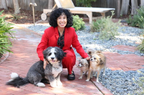 judie red suit with dogs fergie, twiggy, petula